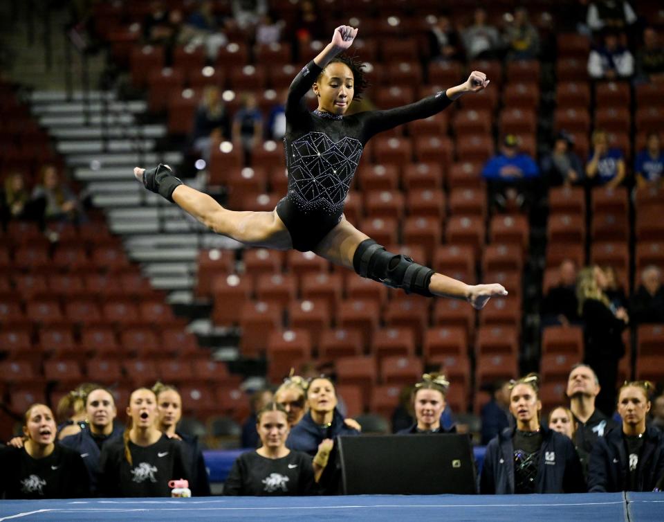 Utah State’s Amari Evans, celebrates performs her floor routine as BYU, Utah, SUU and Utah State meet in the Rio Tinto Best of Utah Gymnastics competition at the Maverick Center in West Valley City on Monday, Jan. 15, 2024. | Scott G Winterton, Deseret News