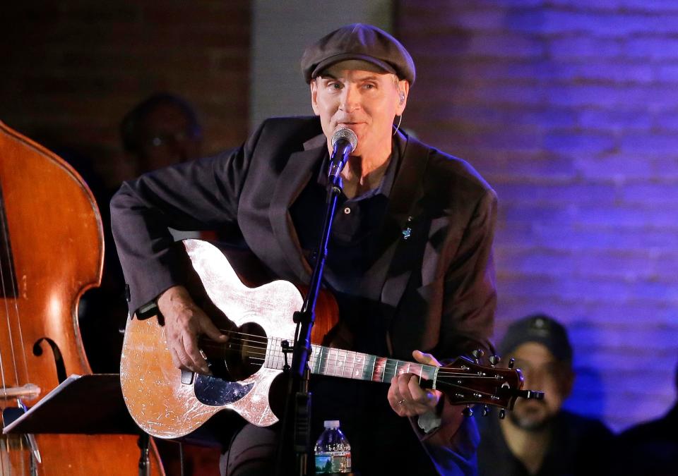 In this Sunday, Nov. 6, 2016, file photo, musician James Taylor performs in Manchester, New Hampshire.