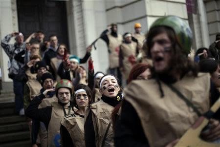 Protesting students wearing fake military uniforms participate in a demonstration in front of Sofia University November 20, 2013. REUTERS/Stoyan Nenov