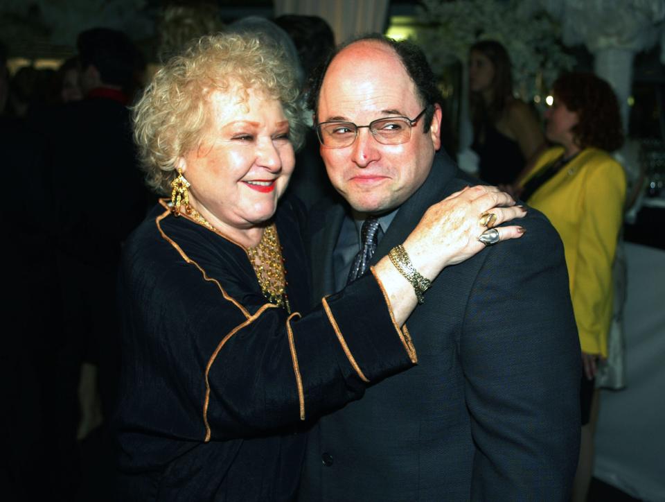 Estelle Harris holding Jason Alexander