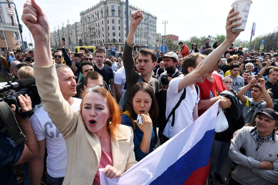 <p>Opposition supporters shout slogans during an unauthorized anti-Putin rally called by opposition leader Alexei Navalny on May 5, 2018 in Moscow, two days ahead of Vladimir Putin’s inauguration for a fourth Kremlin term. (Photo: Kirill Kudryavtsev/AFP/Getty Images) </p>