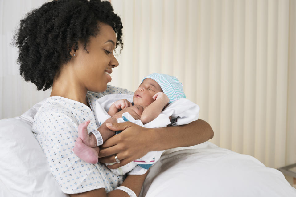 Baby names - mom holding newborn baby