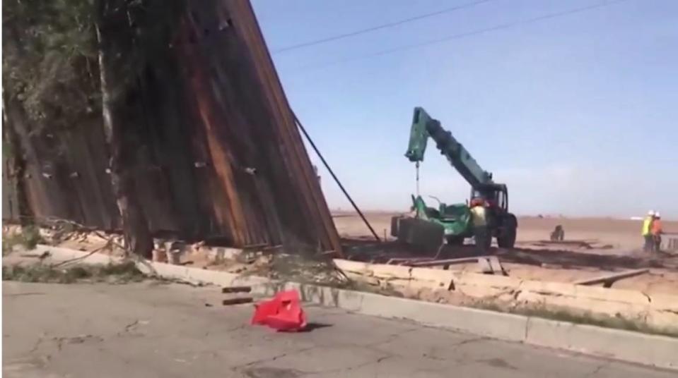 Video shows a section of newly built US-Mexico border wall that Trump has pushed for falling over amid high winds in Southern California. El Centro Sector agents said concrete holding the panels hadn’t cured.