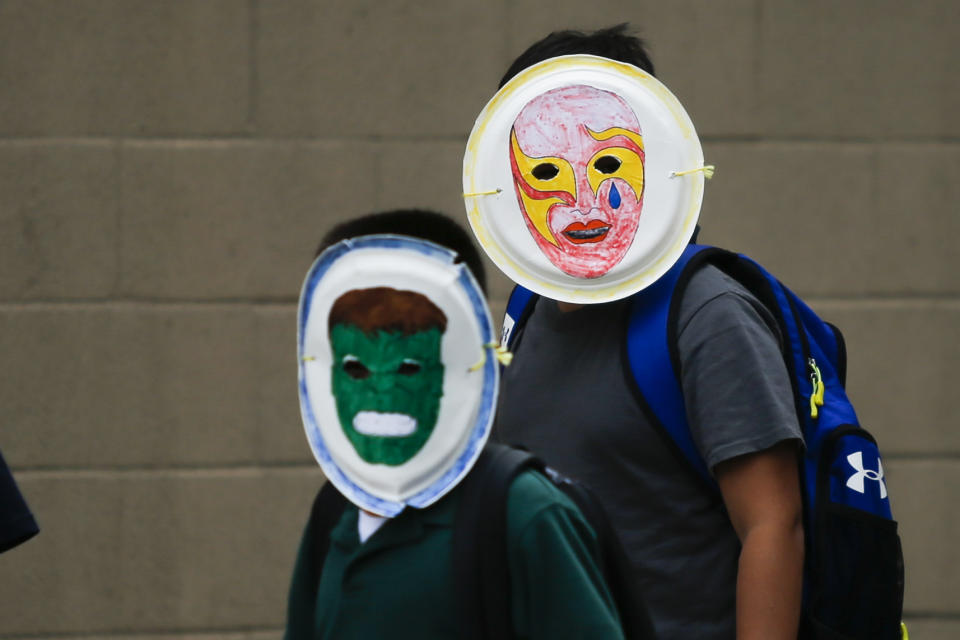 Children wearing masks exit the Cayuga Centers branch on June 22, 2018 in Harlem, N.Y. More than 239 migrant children who were separated from their parents and relatives at the U.S.-Mexico border are under Cayuga Centers care in New York. (Photo: Eduardo MunozAlvarez/VIEWpress/Corbis via Getty Images)