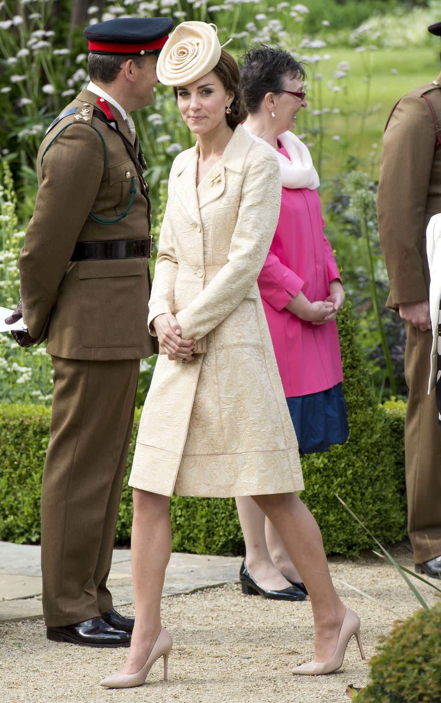 <p>Kate Middleton attends a garden party in Northern Ireland in a beige coat dress by Day Birger et Mikkelsen with matching pumps and a rosette hat by Lock & Co.</p>