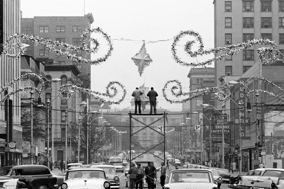 Workers install Christmas decorations on Fayetteville Street in downtown Raleigh, NC November 16, 1961.