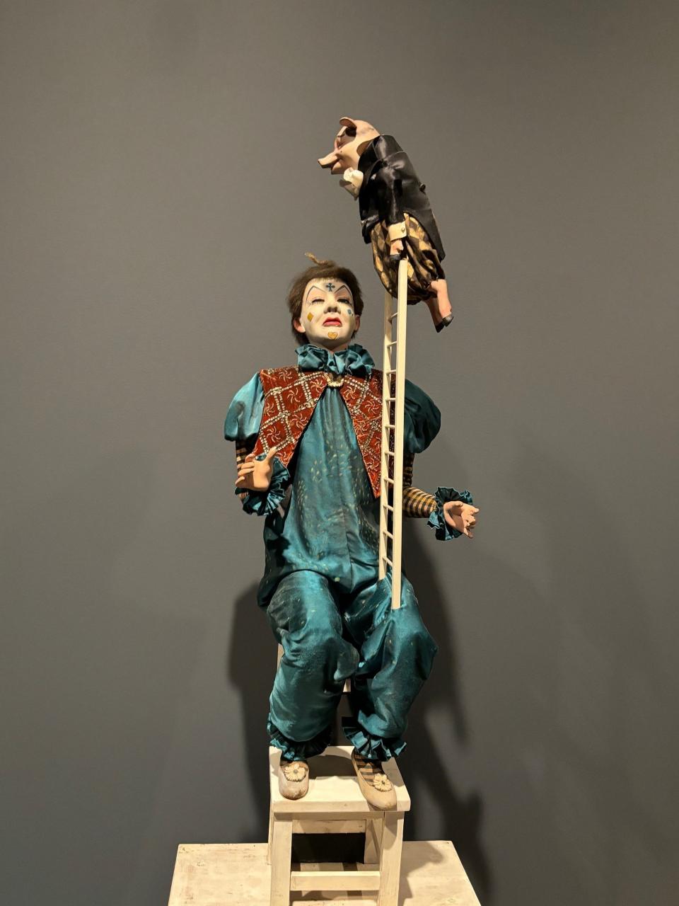A papier-mâché and mixed media musical automaton of a clown and an acrobatic pig greets visitors to the "Jamie Wyeth: Unsettled" exhibition at the Brandywine Museum of Art. The 19th-century musical mechanism made in France is owned by Wyeth and plays four tinkling bell songs.