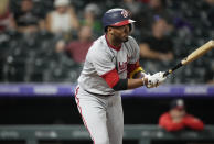 Washington Nationals' Alcides Escobar singles against Colorado Rockies starting pitcher German Marquez in the fifth inning of a baseball game Monday, Sept. 27, 2021, in Denver. (AP Photo/David Zalubowski)