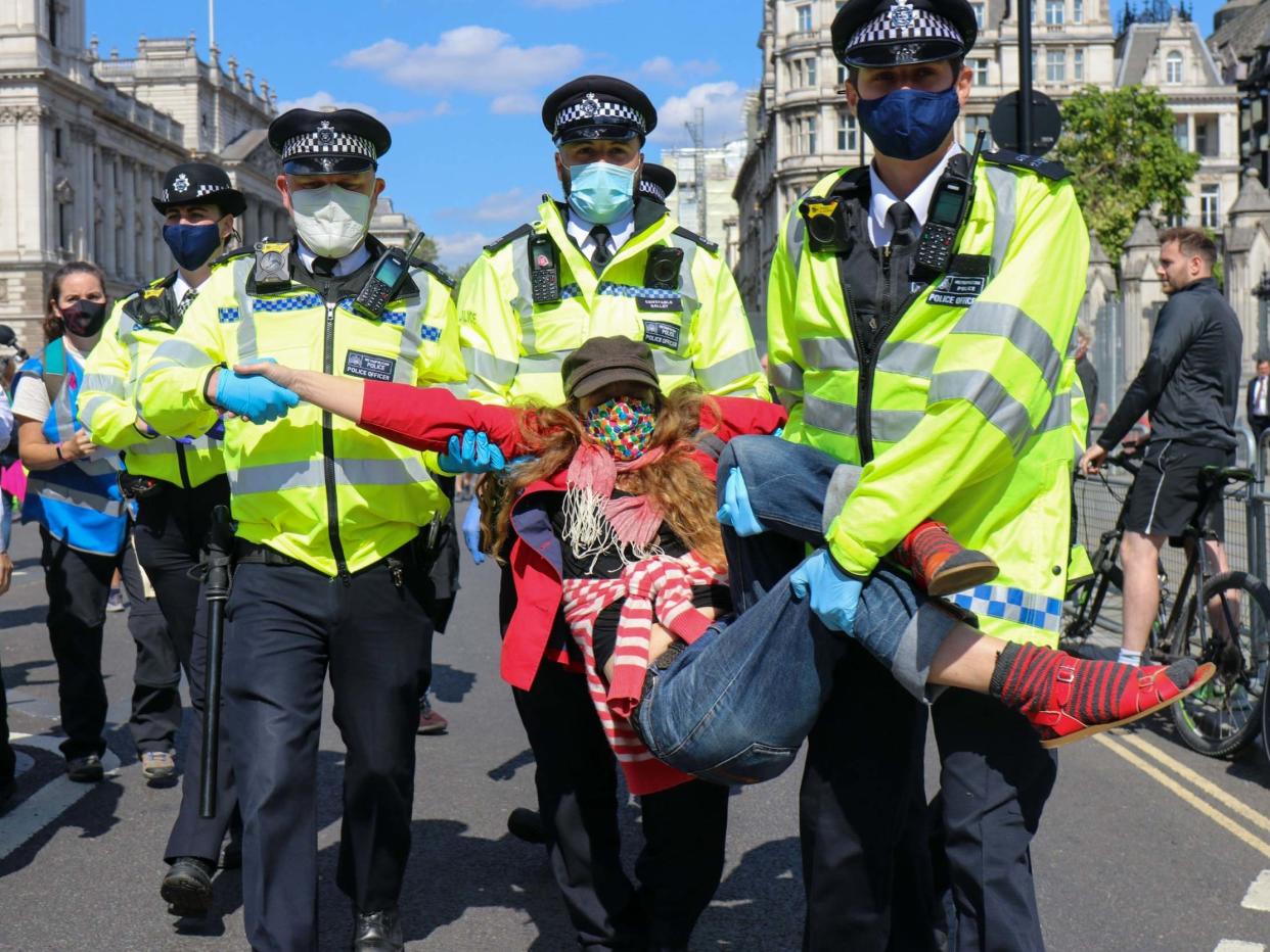 XR activist led away by police near Parliament Square: Lucy North/MI News