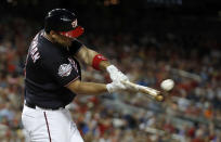 Washington Nationals' Ryan Zimmerman hits a home run during the fourth inning of the team's baseball game against the New York Mets at Nationals Park, Tuesday, July 31, 2018, in Washington. The Nationals won 25-4. (AP Photo/Alex Brandon)