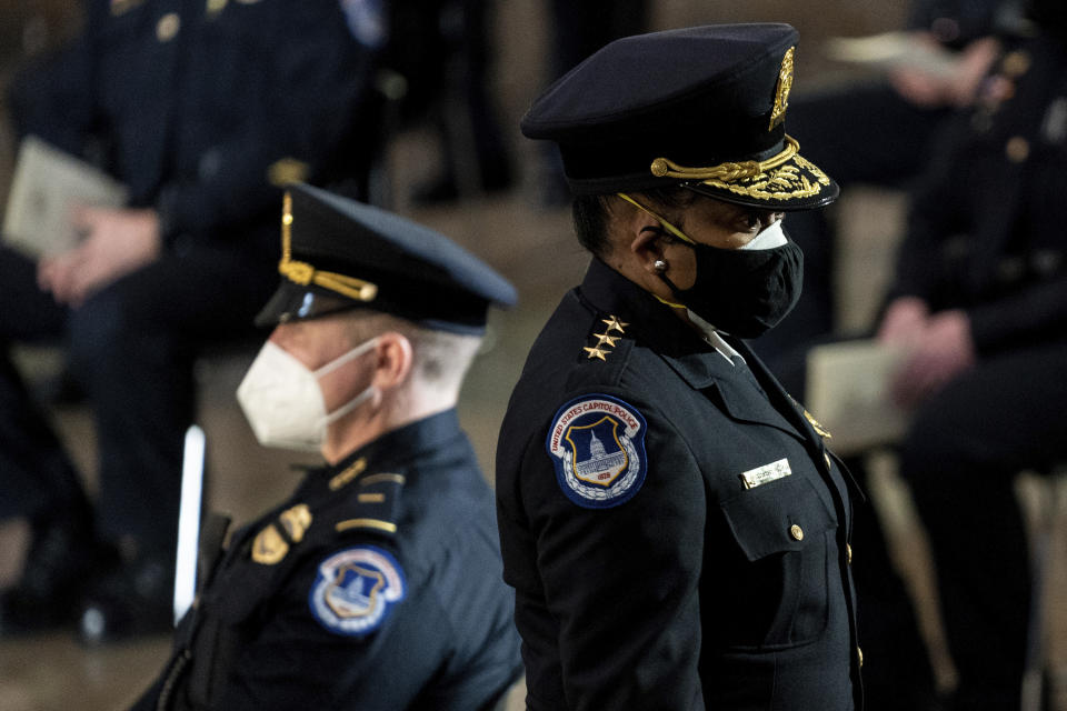 Capitol Police Acting Chief Yogananda Pittman departs a ceremony memorializing U.S. Capitol Police officer Brian Sicknick, as an urn with his cremated remains lies in honor on a black-draped table at the center of the Capitol Rotunda, Wednesday, Feb. 3, 2021, in Washington. (Erin Schaff/The New York Times via AP, Pool)