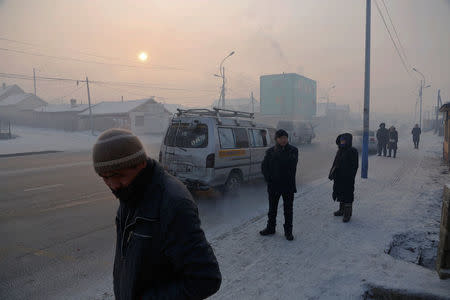 People commute in an industrial area on a cold day in Ulaanbaatar, Mongolia, January 19, 2017. REUTERS/B. Rentsendorj