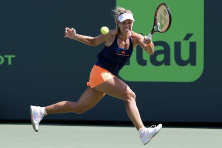 Mar 26, 2017; Miami, FL, USA; Angelique Kerber of Germany hits a forehand against Shelby Rogers of the United States (not pictured) on day six of the 2017 Miami Open at Crandon Park Tennis Center. Kerber won 6-4, 7-5. Mandatory Credit: Geoff Burke-USA TODAY Sports