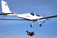 Swiss adventurer Raphael Domjan jumps from the SolarStratos solar powered aircraft prototype with Spanish test pilot Miguel A. Iturmendi aboard during a test flight and attempt to break two world records at the airbase in Payerne, Switzerland, Tuesday, Aug. 25, 2020. Two world record were made during today's test flight, the first jump in history from an electric aircraft exclusively charged with solar energy and the first solar free fall. The main objective of the SolarStratos Mission project is to be the first solar flight to achieve stratospheric flight. (Laurent Gillieron/Keystone via AP)