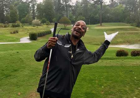 Rapper Snoop Dogg reacts after taking a few practice swings at a golf course in Augusta, Georgia, U.S., April 5, 2017. REUTERS/Rory Carroll