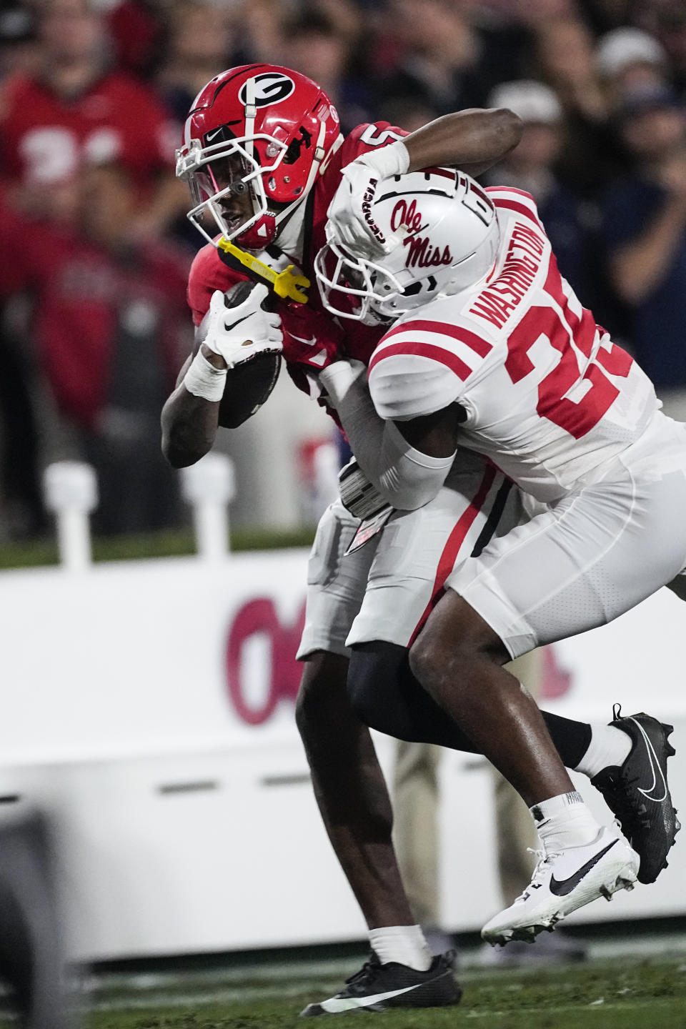 Georgia wide receiver Rara Thomas (5) tries to fend off Mississippi safety Nick Cull (29) after a catchduring the first half of an NCAA college football game, Saturday, Nov. 11, 2023, in Athens, Ga. (AP Photo/John Bazemore)