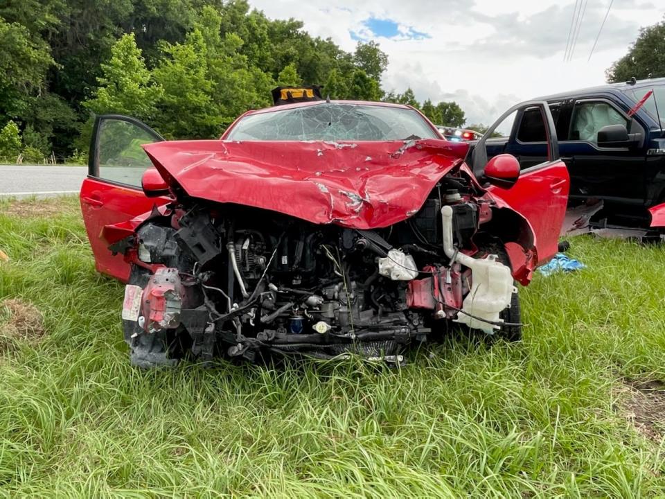 The front of a Mazda2 car was severely damaged in a two-vehicle crash in Morriston on Friday. A passenger in the car died in the wreck, FHP troopers said.