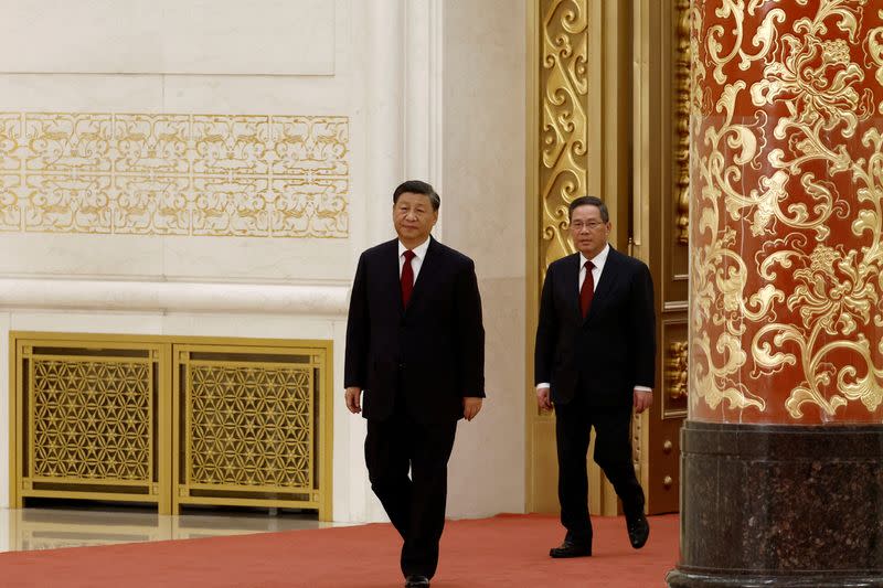 FILE PHOTO: New Politburo Standing Committee members in Beijing