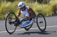FILE - In this Saturday, Oct. 10, 2015 file photo, Alex Zanardi, of Italy, rides during the cycling portion of the Ironman World Championship Triathlon, in Kailua-Kona, Hawaii. Race car driver turned Paralympic champion Alex Zanardi has been seriously injured again. Police tell The Associated Press that Zanardi was transported by helicopter to a hospital in Siena following a road accident near the Tuscan town of Pienza during a national race for Paralympic athletes on handbikes. The 53-year-old Zanardi had both of his legs amputated following a horrific crash during a 2001 CART race in Germany. He was a two-time CART champion. (AP Photo/Mark J. Terrill, File)
