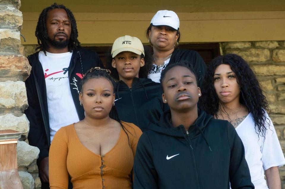 The family of 12-year-old Brian Henderson Jr., father, Brian Henderson, mother, Monica Henderson, sisters, from left to right, Kelsey Henderson, Brilyn Henderson, Brooke Johnson and Bobbi Hubbard, were pictured in front of their Kansas City home. Brian Henderson Jr., a student at University Academy, known as BJ to his family and friends, was fatally shot outside a pharmacy store in Leavenworth on April 14, 2021. “He was destined to be great,” said Brian Henderson of his son.