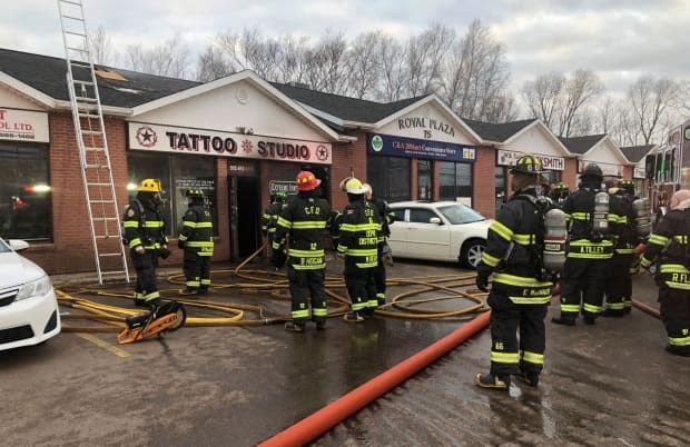 Firefighters on the scene of the fire at Extreme Ink Tattoo Studio in Charlottetown Thursday morning.