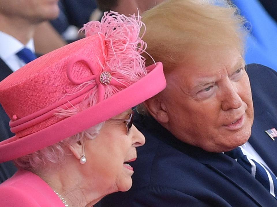 Britain's Queen Elizabeth II (L) talks with US President Donald Trump during an event to commemorate the 75th anniversary of the D-Day landings, in Portsmouth, southern England, on June 5, 2019 (AFP via Getty Images)