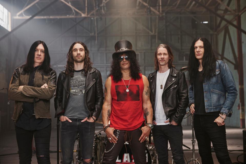 Slash (center) featuring Myles Kennedy and the Conspirators.