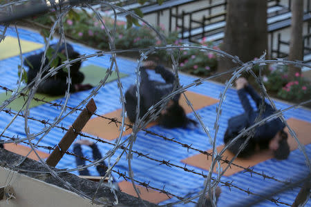 Women prisoners attend a yoga class at Chiang Mai Women's Correctional Institute, in Chiang Mai, Thailand, January 25, 2018. REUTERS/Athit Perawongmetha