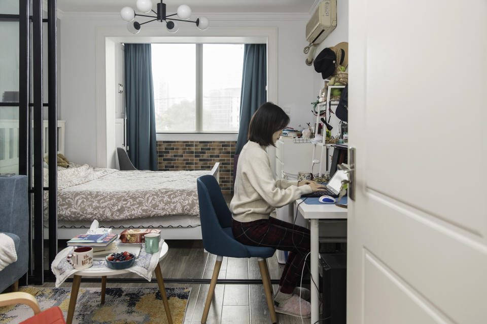 Image: An employee works from her home in Shanghai (Qilai Shen / Bloomberg via Getty Images)