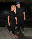 <p>The couple’s relationship (and engagement) went up in flames this year, leading to Kardashian’s July social media meltdown, where he posted a series of explicit photos of Chyna, <a rel="nofollow" href="https://www.yahoo.com/entertainment/rob-kardashian-puts-cheating-ex-blac-chyna-blast-explicit-photos-text-receipts-160101108.html" data-ylk="slk:claiming;elm:context_link;itc:0;sec:content-canvas;outcm:mb_qualified_link;_E:mb_qualified_link;ct:story;" class="link  yahoo-link">claiming</a> that she had cheated on him and had substance-abuse issues. Chyna alleged that Kardashian was violent toward her and threatened suicide. She filed a lawsuit against not just her ex, but the <a rel="nofollow" href="https://www.yahoo.com/entertainment/blac-chyna-sues-rob-kardashian-powerful-vindictive-family-nude-photo-scandal-211902475.html" data-ylk="slk:entire Kardashian family;elm:context_link;itc:0;sec:content-canvas;outcm:mb_qualified_link;_E:mb_qualified_link;ct:story;" class="link  yahoo-link">entire Kardashian family</a> for “damaging her brand and verbally and physically abusing her.” Rob and Kylie <a rel="nofollow" href="https://www.yahoo.com/entertainment/rob-kardashian-kylie-jenner-sue-012224590.html" data-ylk="slk:countersued;elm:context_link;itc:0;sec:content-canvas;outcm:mb_qualified_link;_E:mb_qualified_link;ct:story;" class="link  yahoo-link">countersued</a>, claiming assault and that baby Dream was part of a shakedown attempt. Needless to say, Chyna didn’t make it into the <a rel="nofollow" href="https://www.yahoo.com/lifestyle/kim-kardashian-slowly-unveils-2017-slideshow-wp-202439769.html" data-ylk="slk:Kardashian Christmas card;elm:context_link;itc:0;sec:content-canvas;outcm:mb_qualified_link;_E:mb_qualified_link;ct:story;" class="link  yahoo-link">Kardashian Christmas card</a>. (Photo: Getty Images) </p>