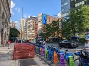 <p>A picture from the Pixel 6a's ultrawide camera, featuring colorful Citibike posts and several blue bicycles with several NYC buildings in the background.</p> 