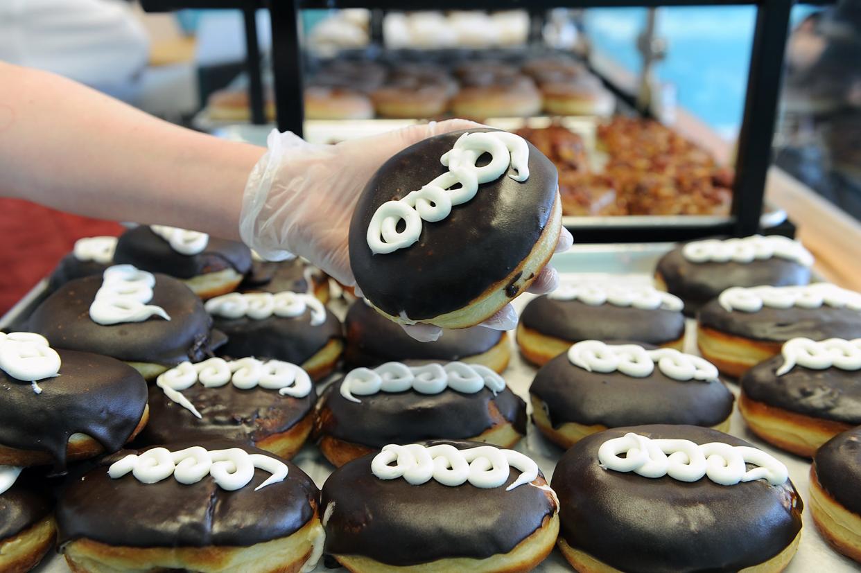 A tray of hostess CupCake donuts is made at Basic Batch Donuts in Milford