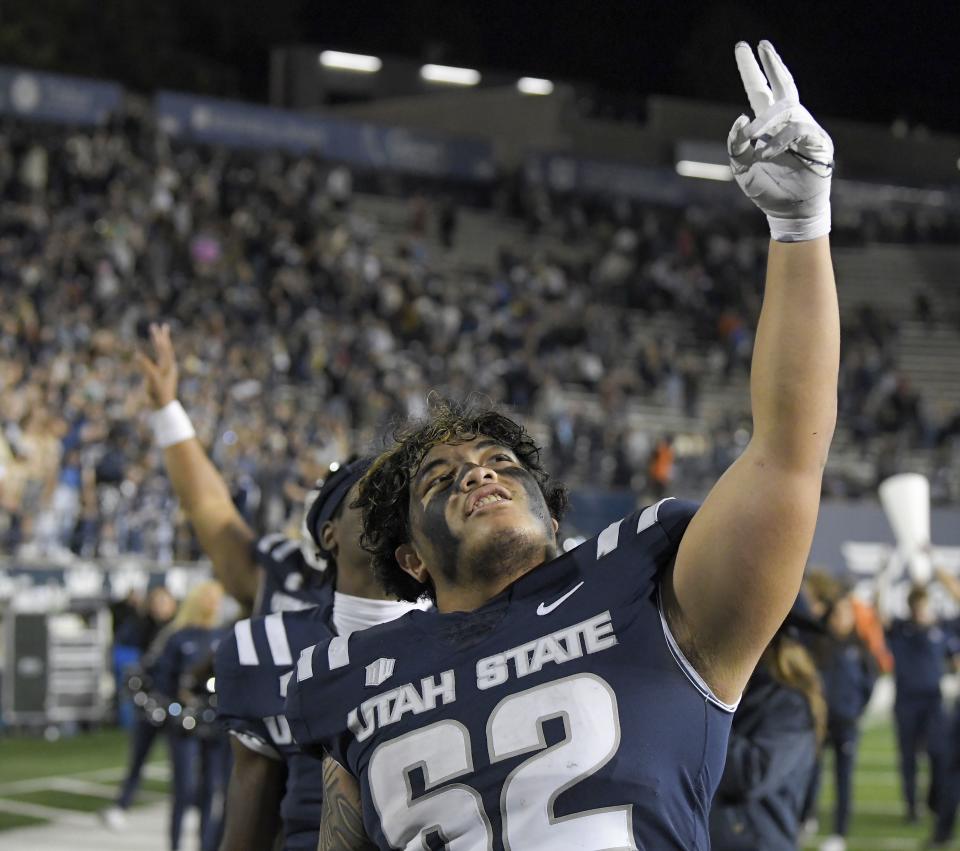 Utah State offensive lineman Aloali’i Maui celebrates the team’s win over Colorado State in an NCAA college football game Saturday, Oct. 7, 2023, in Logan, Utah. | Eli Lucero/The Herald Journal via AP