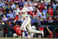 Philadelphia Phillies' Alec Bohm watches his RBI single off Atlanta Braves' Aaron Bummer during the sixth inning of a baseball game, Sunday, March 31, 2024, in Philadelphia. (AP Photo/Derik Hamilton)