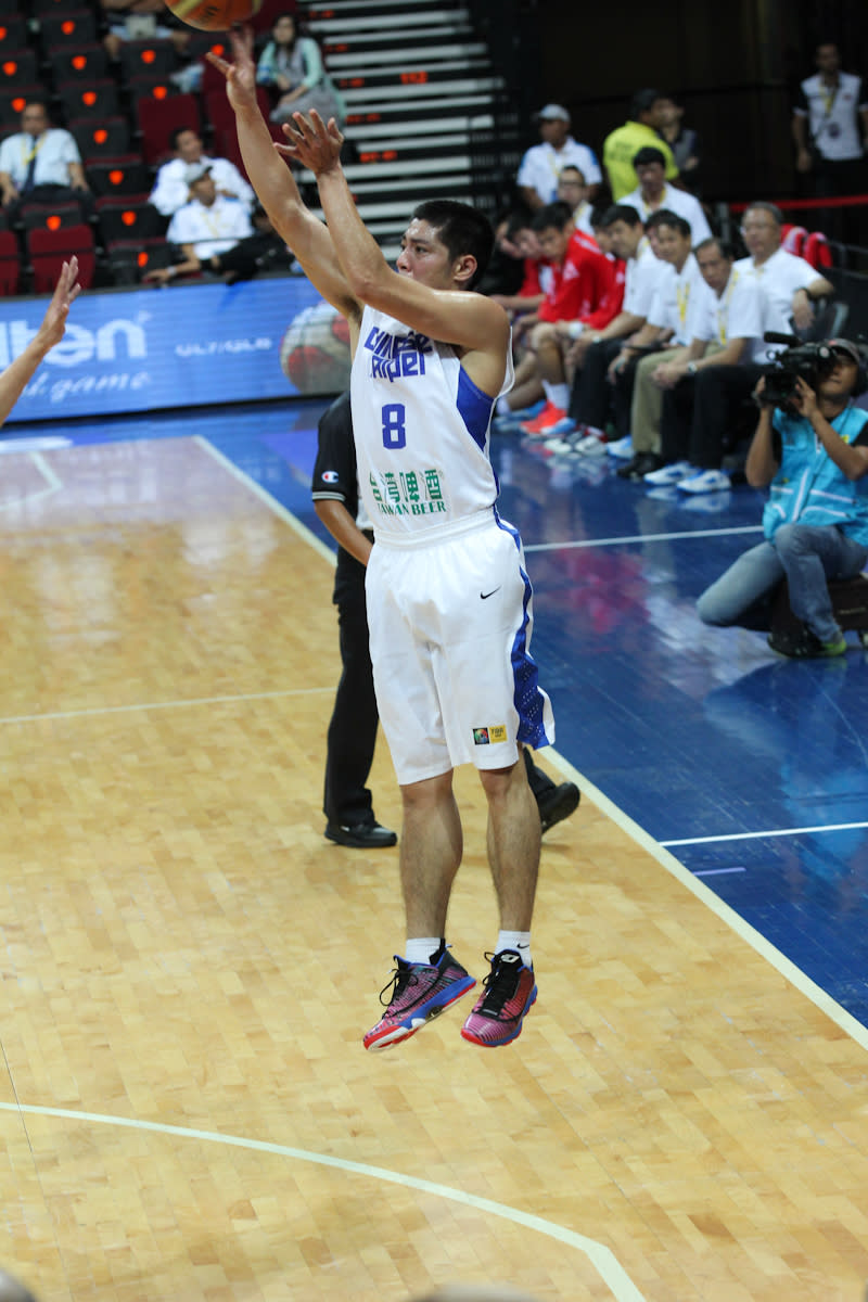 Wen-Ting Tseng of Chinese Taipei tries to shoot during the second