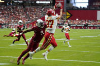 Kansas City Chiefs tight end Travis Kelce (87) catches a pass for a touchdown against Arizona Cardinals linebacker Isaiah Simmons (9) during the first half of an NFL football game, Sunday, Sept. 11, 2022, in Glendale, Ariz. (AP Photo/Ross D. Franklin)