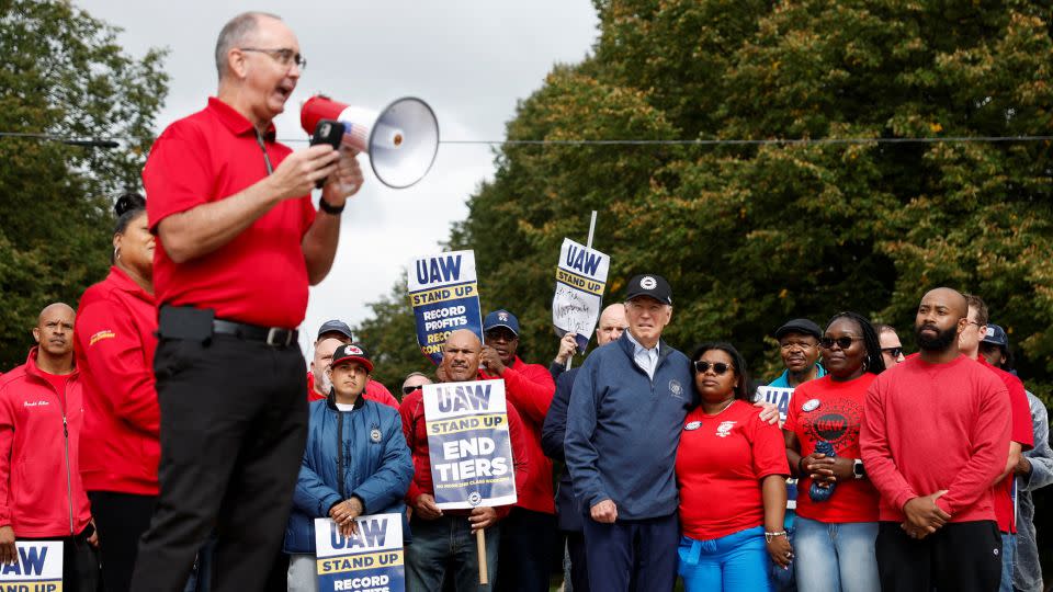 Shawn Fain, president of the United Auto Workers, speaks as Biden joins striking members of the United Auto Workers on the picket line outside the GM's Willow Run Distribution Center, in Belleville, Michigan, in September 2023. - Evelyn Hockstein/Reuters
