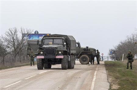 A military truck drives out of Belbek Airport in the Crimea region March 1, 2014. REUTERS/Baz Ratner