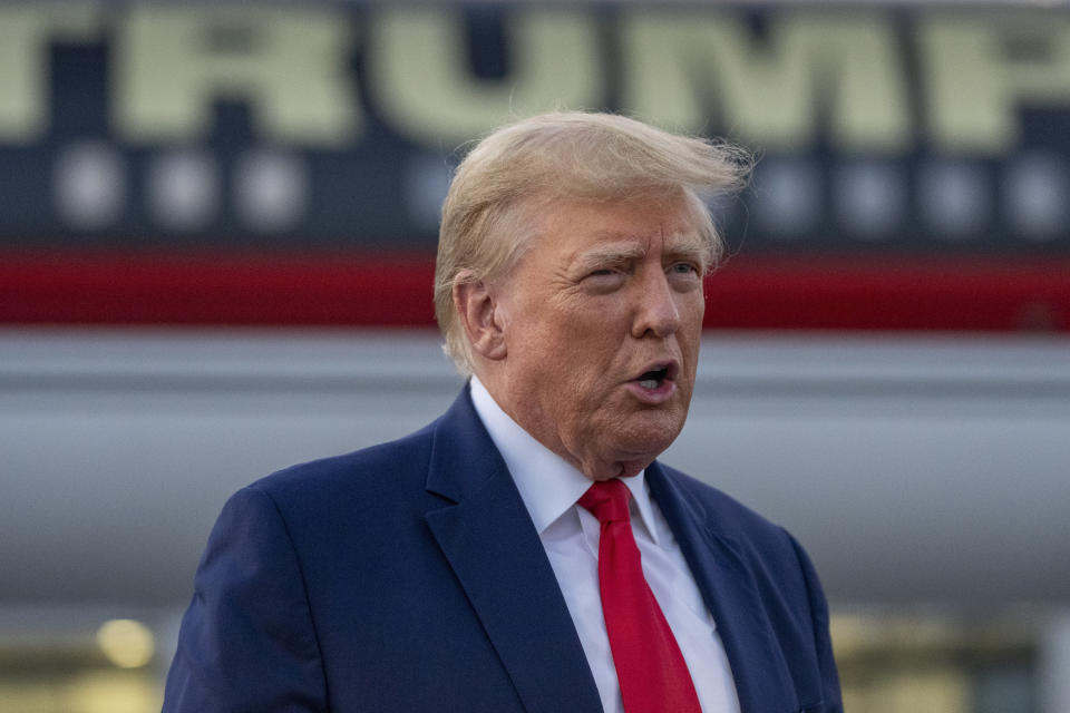 FILE - Former President Donald Trump speaks with reporters before departure from Hartsfield-Jackson Atlanta International Airport, Thursday, Aug. 24, 2023, in Atlanta. (AP Photo/Alex Brandon, File)