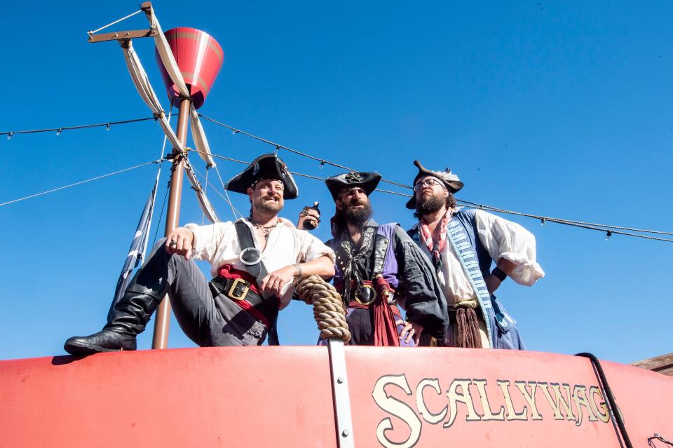 From left: Rodger "Captain Jolly Rodger" Dobry, 41; Jared "Captain Skull" Lewis, 35, and Mark "Bruce Ballard" Welser, 40, are shown, on June 24 at the Scallywags Pirate Adventures on Erie's bayfront.