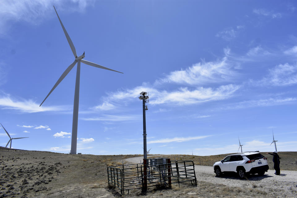 A camera system to detect approaching eagles is seen atop a pole at Duke Energy's Top of the World wind farm, on April 24, 2023, in Rolling Hills, Wyo. The company can shut down its huge turbines when eagles approach too closely, reducing but not eliminating fatal collisions after Duke was criminally prosecuted last decade for not adequately preventing eagle deaths.(AP Photo/Matthew Brown)