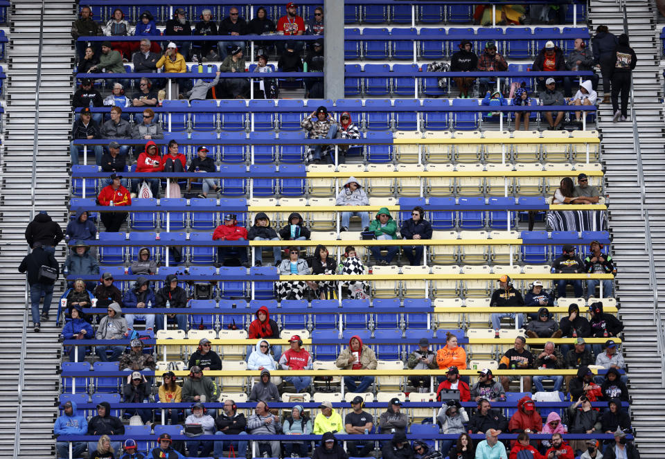 Fans watch from the grandstand during a NASCAR Cup Series auto race at Kansas Speedway in Kansas City, Kan., Sunday, Oct. 24, 2021. (AP Photo/Colin E. Braley)