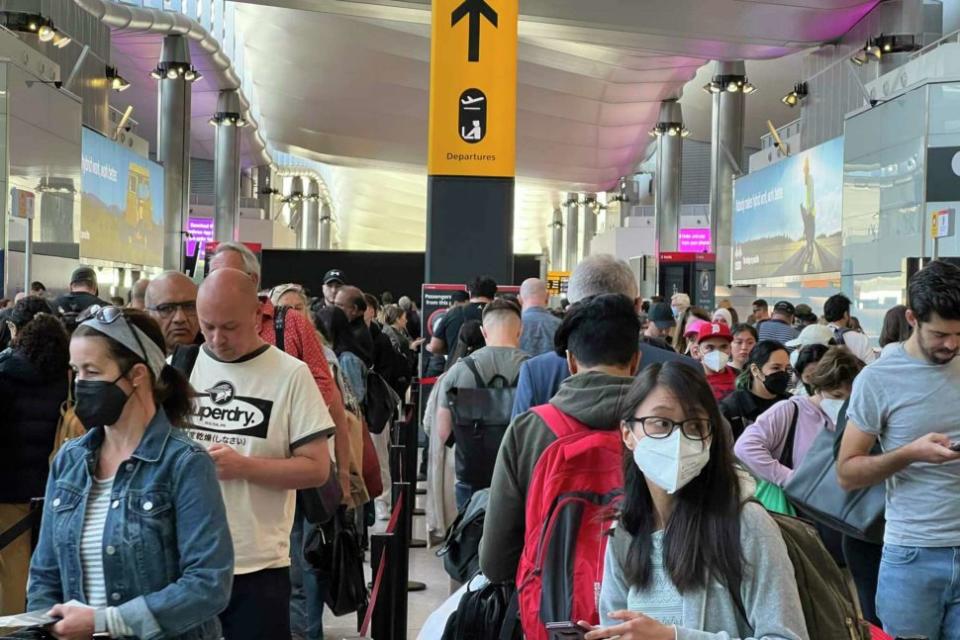 people standing Inside London Heathrow Airport