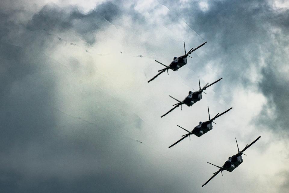 J-20 stealth fighter jets rehearse for an air show.