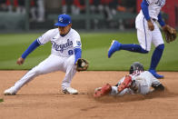 Cleveland Guardians' Myles Straw beats the throw to Kansas City Royals second baseman Nicky Lopez (8) for a steal during the fourth inning of a baseball game, Thursday, April 7, 2022 in Kansas City, Mo. (AP Photo/Reed Hoffmann)