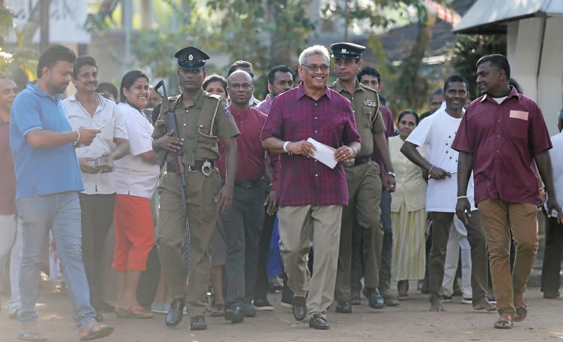 Sri Lanka People's Front party presidential election candidate and former wartime defence chief Rajapaksa leaves after casting his vote during the presidential election in Colombo