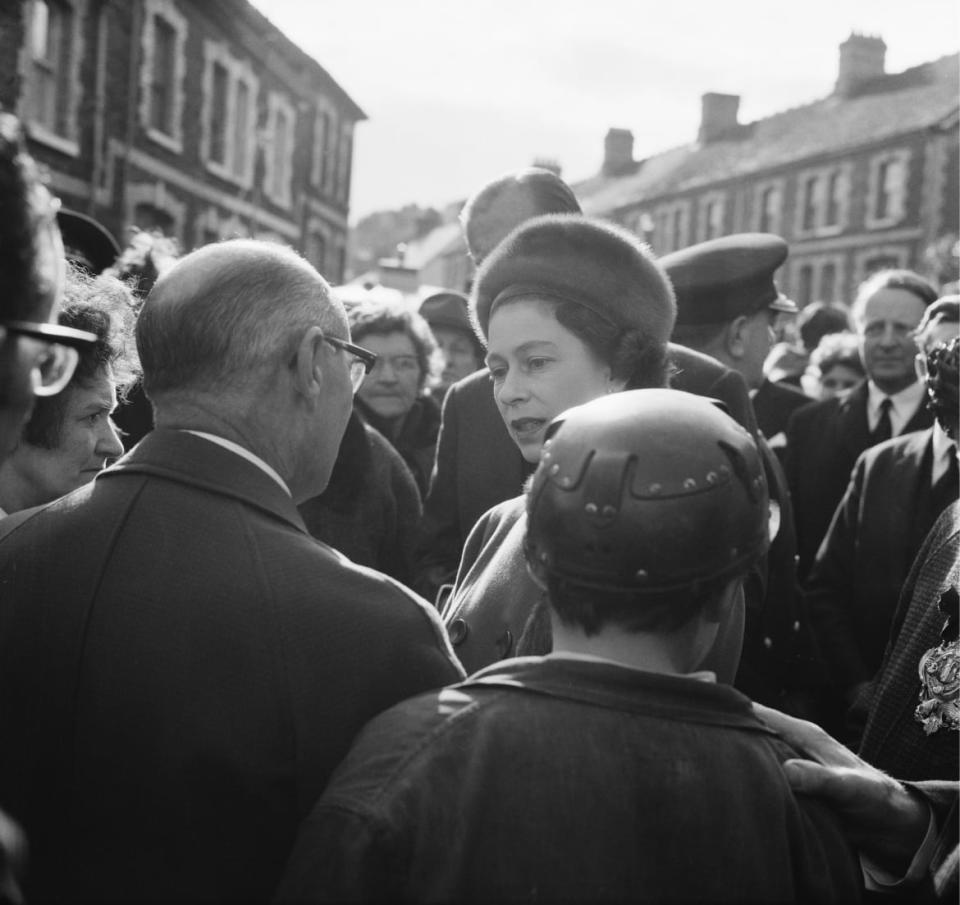 <div class="inline-image__caption"><p>Queen Elizabeth II visits the coal mining village of Aberfan in South Wales, eight days after the disaster in which 116 children and 28 adults were killed, October 29, October 1966. The disaster on 21st October occurred when a colliery spoil-tip collapsed and slid down a nearby mountainside into the village and its two schools.</p></div> <div class="inline-image__credit">Evening Standard/Hulton Archive/Getty</div>