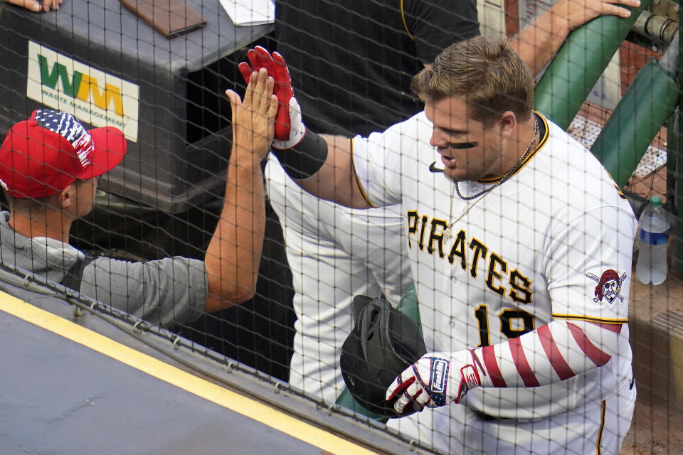 Pittsburgh Pirates' Daniel Vogelbach, right, celebrates as he returns to the dugout after hitting a solo home run off New York Yankees starting pitcher Jameson Taillon during the second inning of a baseball game in Pittsburgh, Tuesday, July 5, 2022. (AP Photo/Gene J. Puskar)