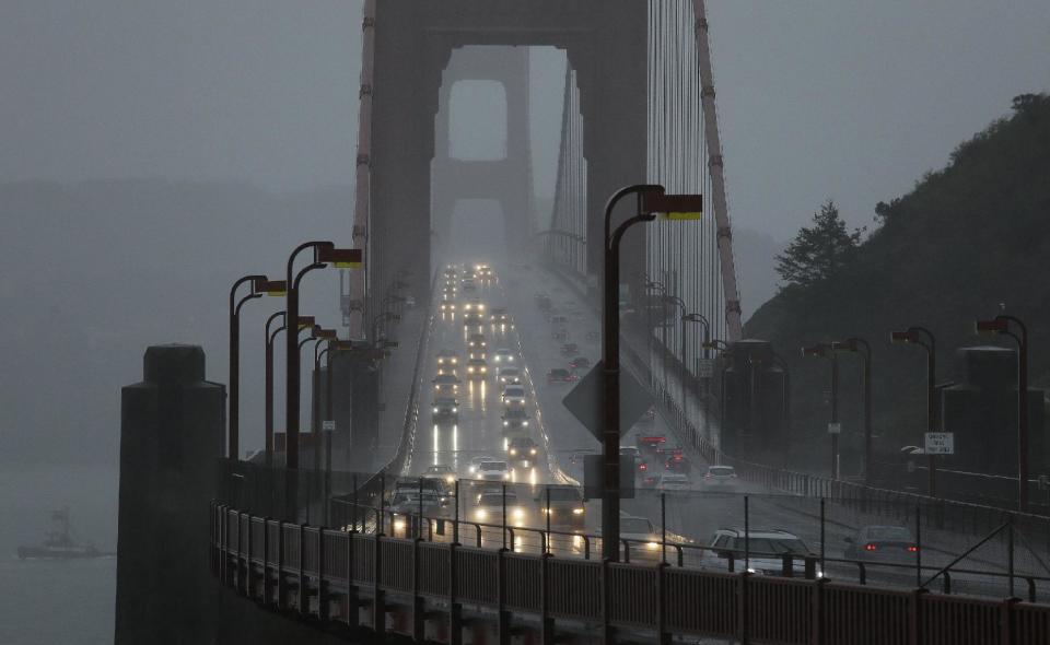 Traffic makes its way in heavy rain across the Golden Gate Bridge Thursday, Dec. 15, 2016, in Sausalito, Calif. One of the strongest rainstorms of the season hit the San Francisco Bay Area on Thursday, with a small town in the North Bay receiving nearly seven inches of rain over the last 24-hour period, forecasters said. Flash-flood warnings are in effect for southern Sonoma County and northern Marin County. (AP Photo/Eric Risberg)