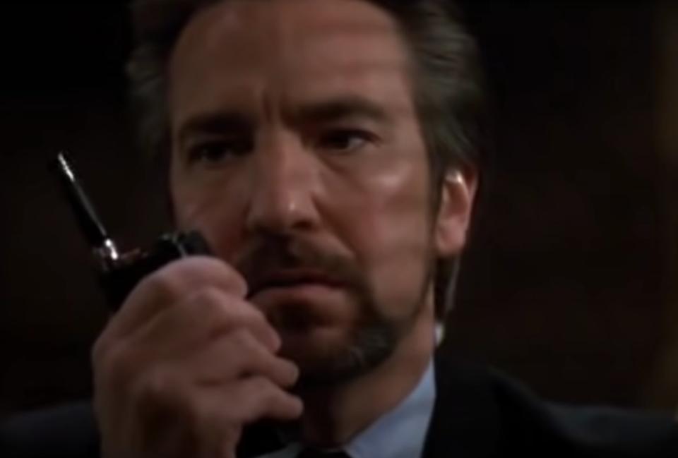 Alan Rickman as Hans Gruber speaks in a walkie talkie in "Die Hard"